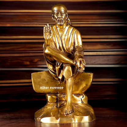 Pure Brass Sai Baba Sitting on Stone idol - 12 inches Nikuressence