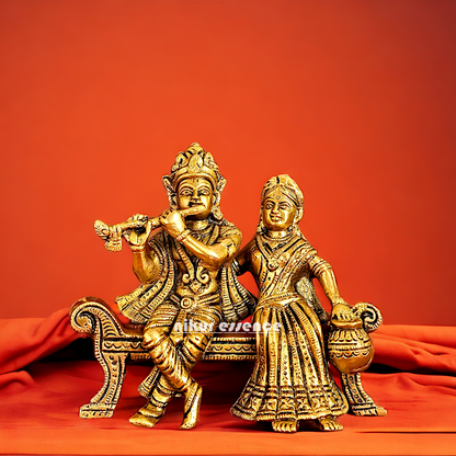 Lord Radha Krishna Sitting on Sofa brass Idol - 6 inches Nikuressence