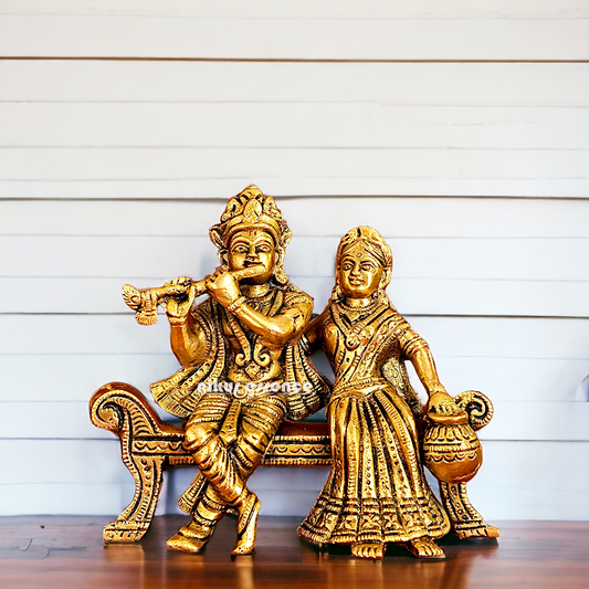 Lord Radha Krishna Sitting on Sofa brass Idol - 6 inches Nikuressence