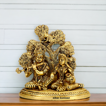 Shop Radha Krishna Sitting with Tree solid Brass idol - 5.5 inch Nikuressence