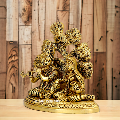 Shop Radha Krishna Sitting with Tree solid Brass idol - 5.5 inch Nikuressence