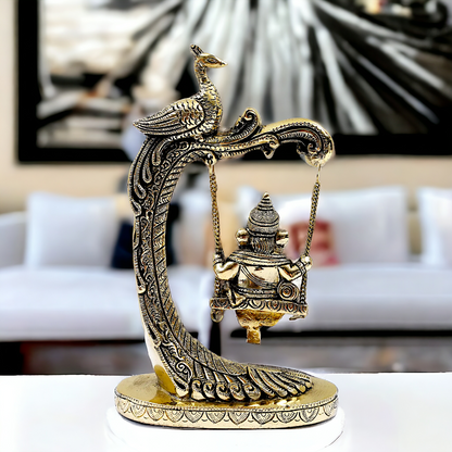 Lord Ganpati swinging Jhula Brass idol - 9 Inches Nikuressence