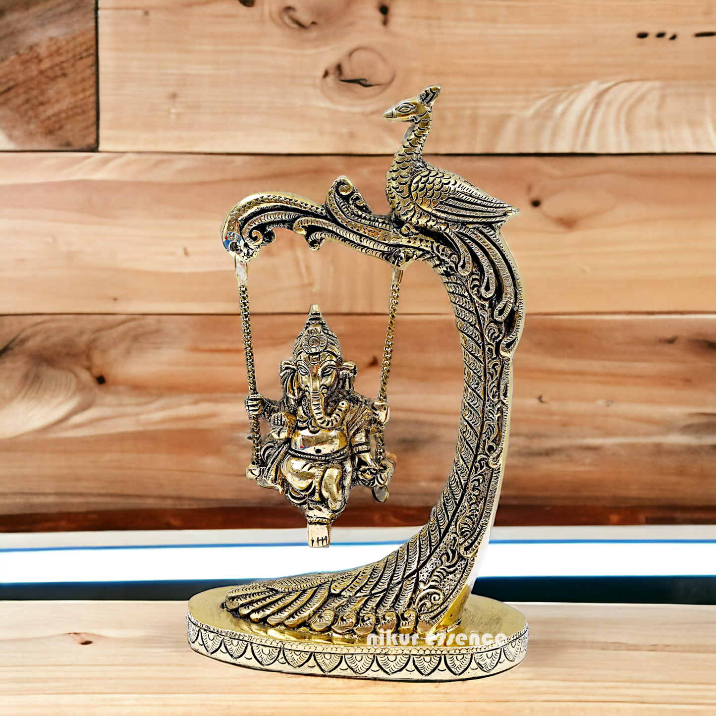 Lord Ganpati swinging Jhula Brass idol - 9 Inches Nikuressence