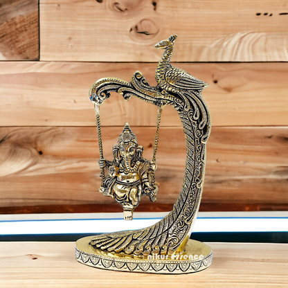 Lord Ganpati swinging Jhula Brass idol - 9 Inches Nikuressence