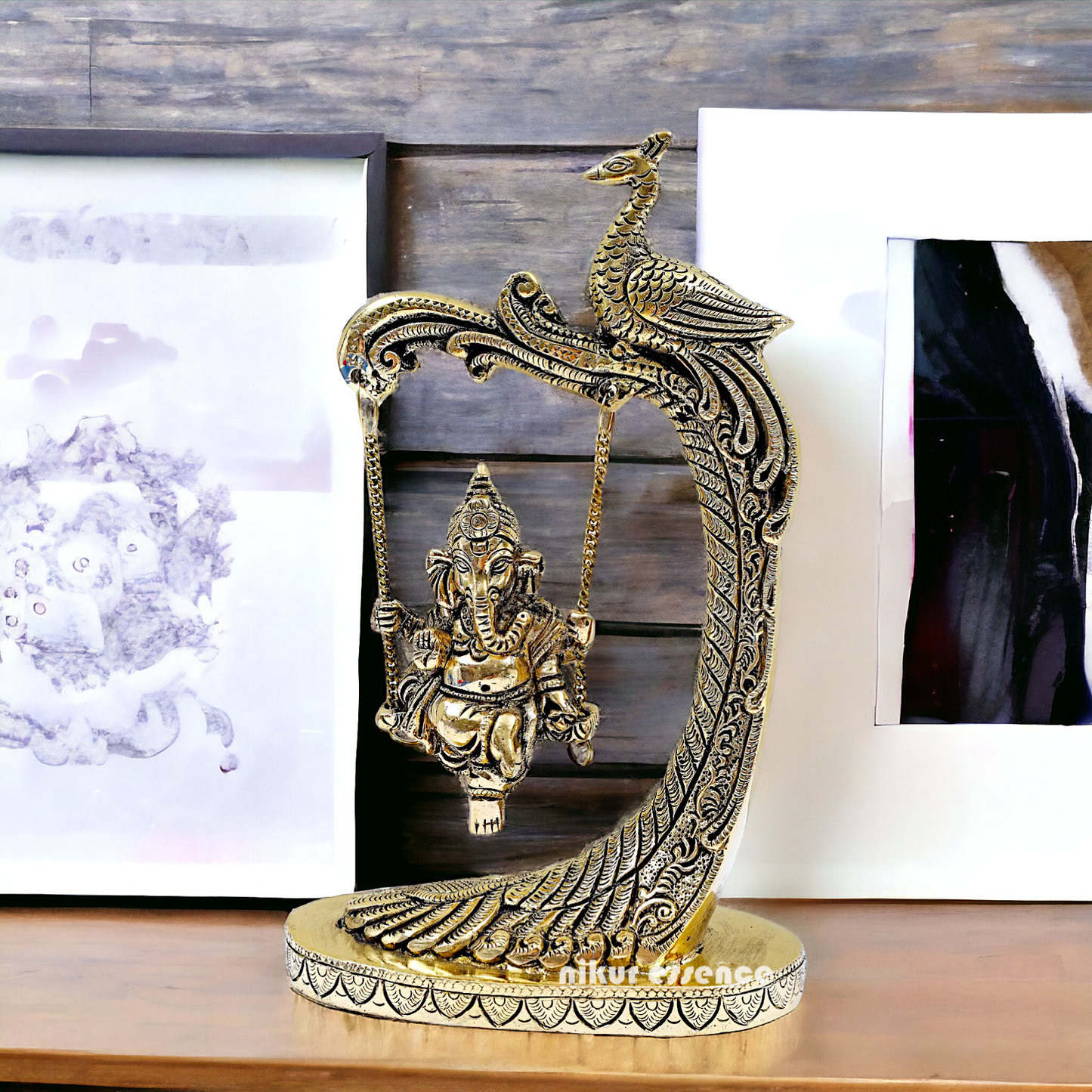 Lord Ganpati swinging Jhula Brass idol - 9 Inches Nikuressence