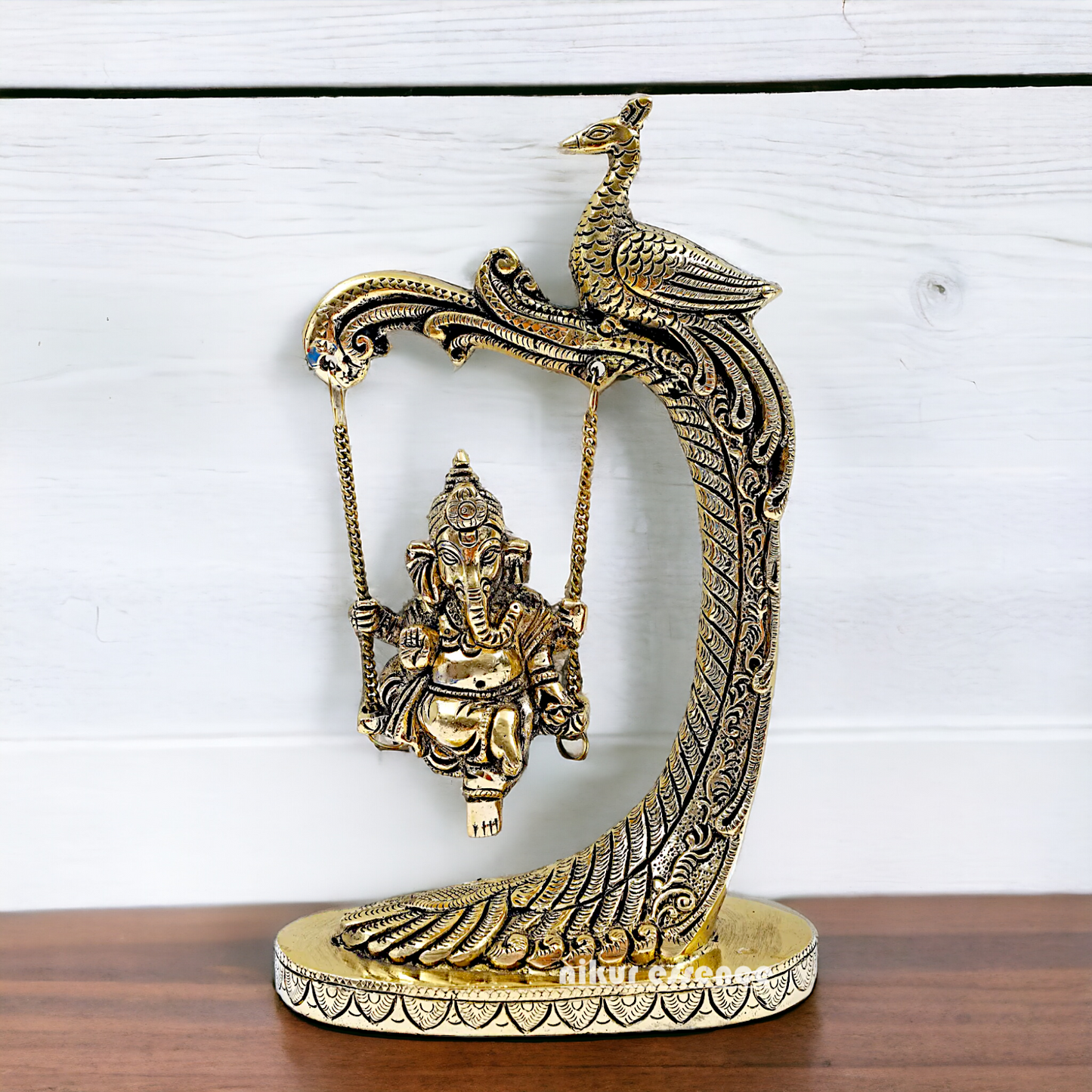 Lord Ganpati swinging Jhula Brass idol - 9 Inches Nikuressence