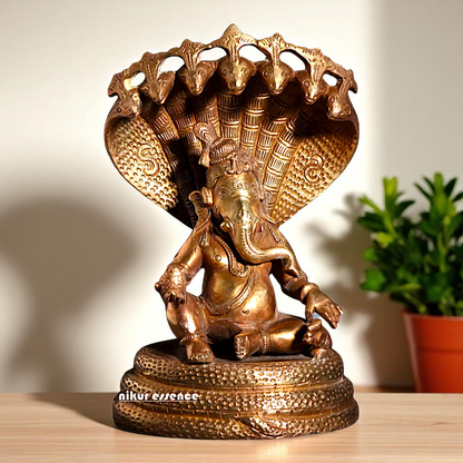 Bronze/Panchaloha Ganesha seated on sheshnag statue - 7 Inches Nikuressence