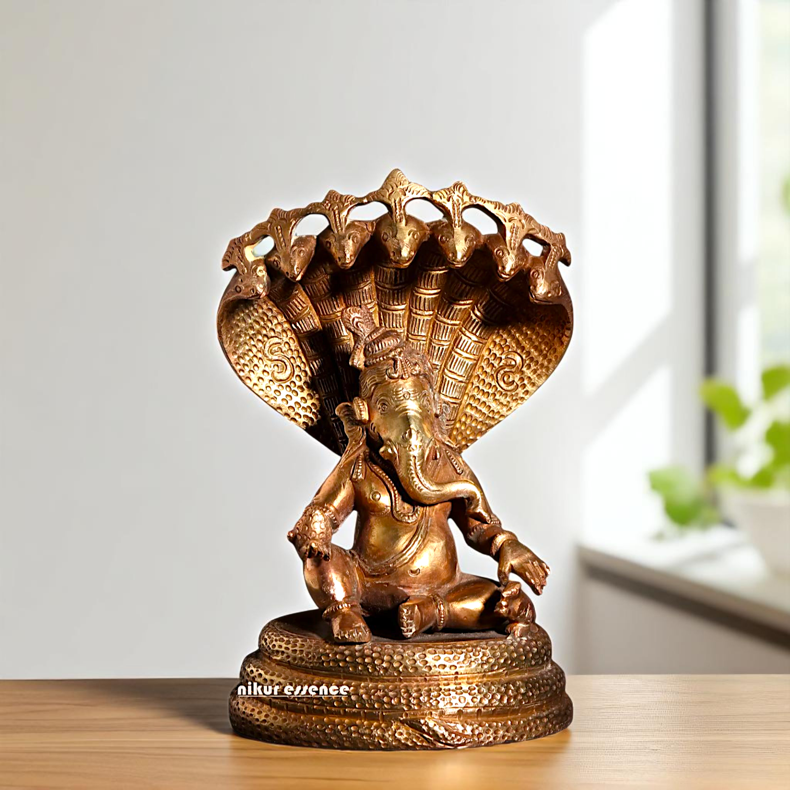 Bronze/Panchaloha Ganesha seated on sheshnag statue - 7 Inches Nikuressence