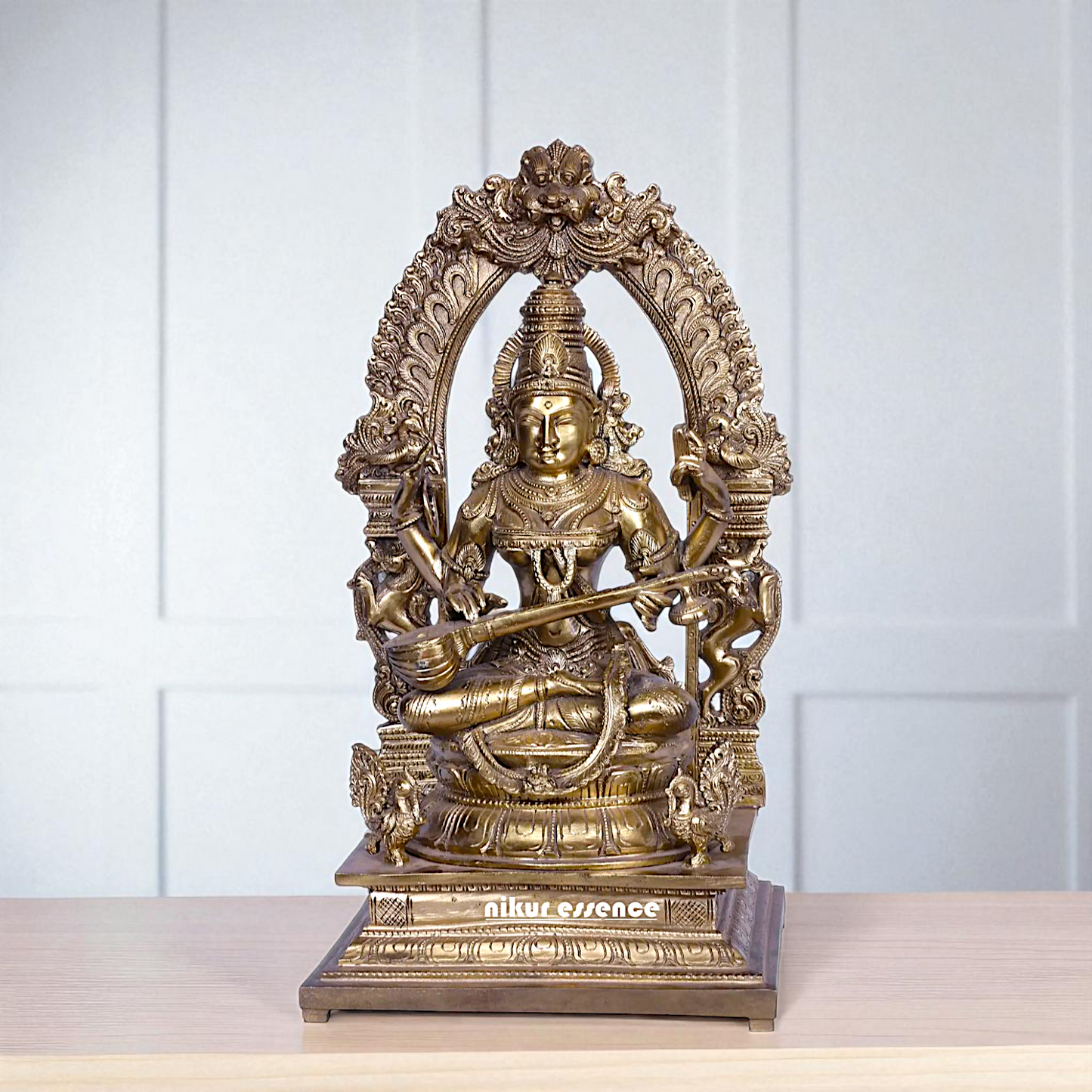 Goddess Saraswati Devi Seated on kirtimukha throne with Playing Veena Bronze/Panchaloha idol - 16 Inches Nikuressence