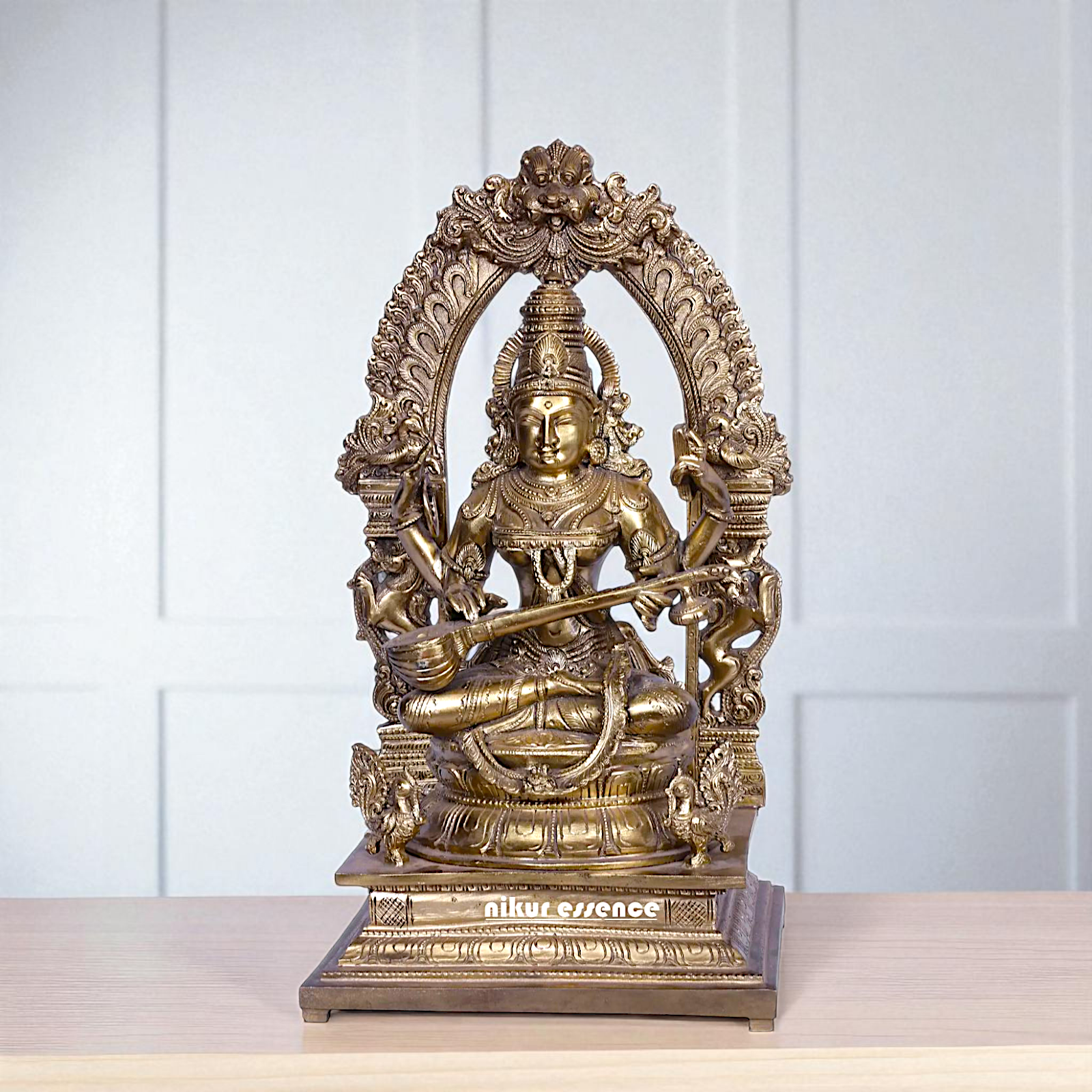Goddess Saraswati Devi Seated on kirtimukha throne with Playing Veena Bronze/Panchaloha idol - 16 Inches Nikuressence