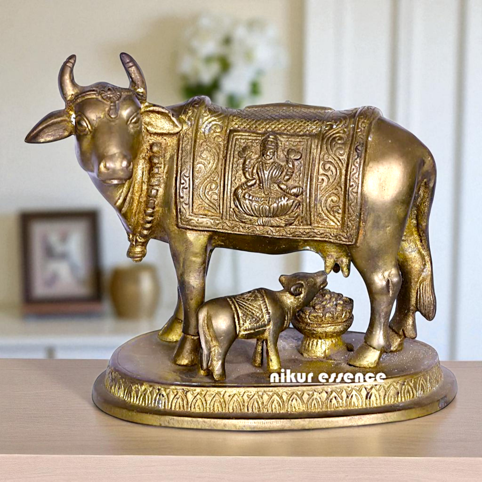 Kamadhenu cow with Lakshmi and Calf Bronze Panchaloha idol - 5 Inches Nikuressence