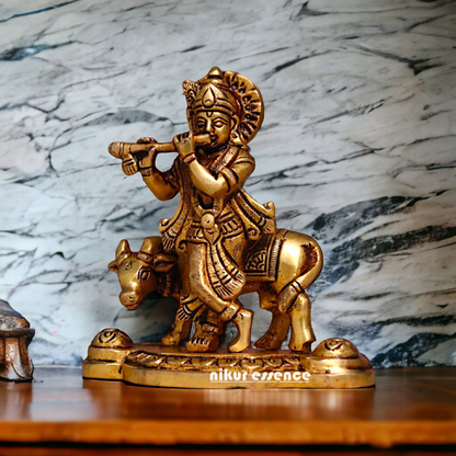 Pital Krishna Bhagwan Cow with Playing Flute Brass Idol - 4.2 inches Nikuressence