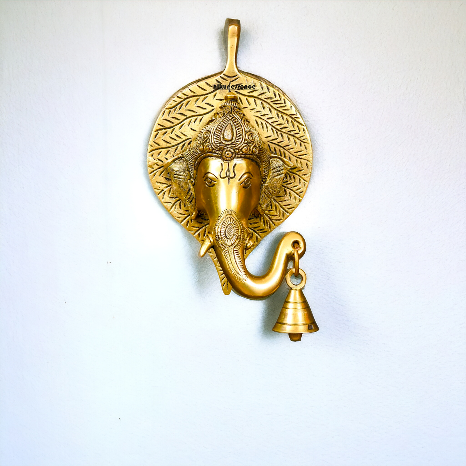Ganesha on leaf with Bells brass wall hanging idol - 7.5 Inches Nikuressence
