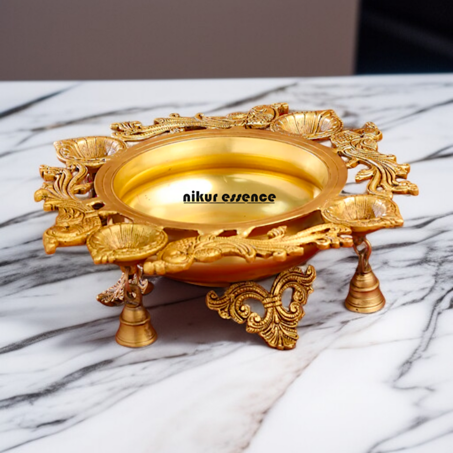 Brass Peacock Urli with 4 diya Nikuressence