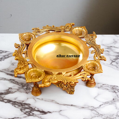 Brass Peacock Urli with 4 diya Nikuressence