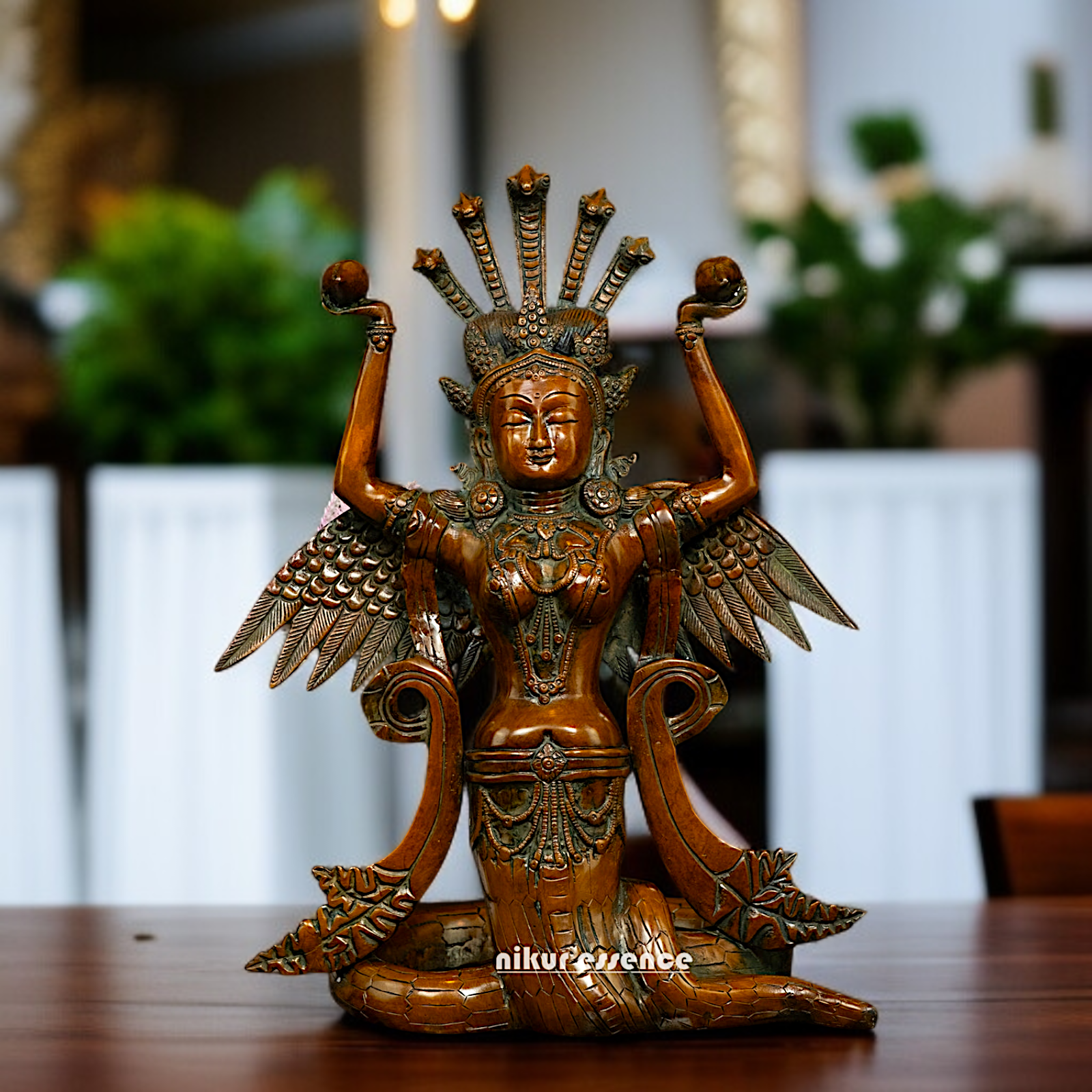 Naag Kanya Seated holding conch Brass statue - 15 Inches Nikuressence