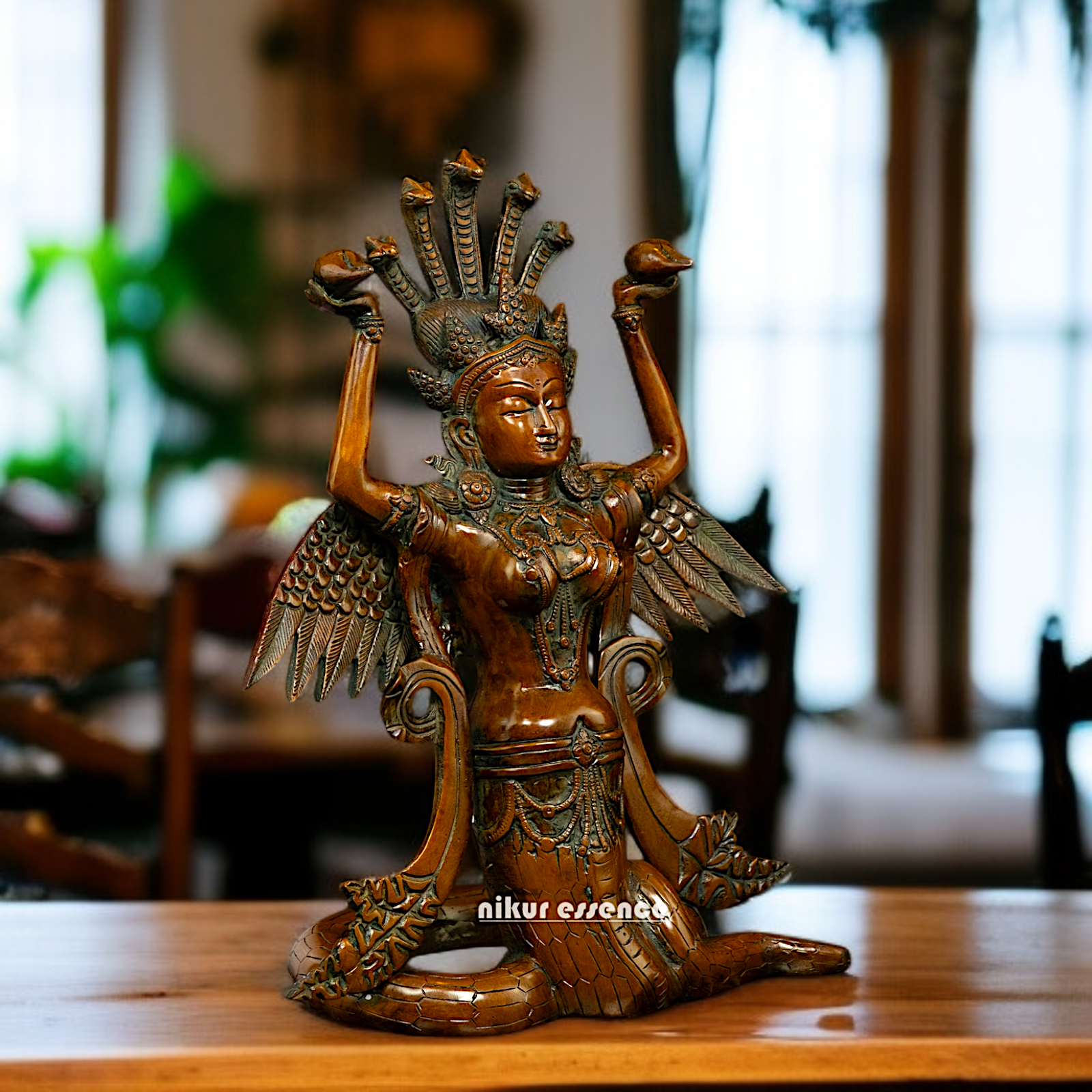 Naag Kanya Seated holding conch Brass statue - 15 Inches Nikuressence