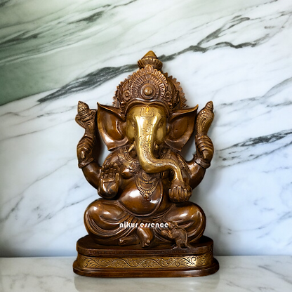 Ganesh Blessing seated with Four Armed Brass idol - 14 Inches Nikuressence