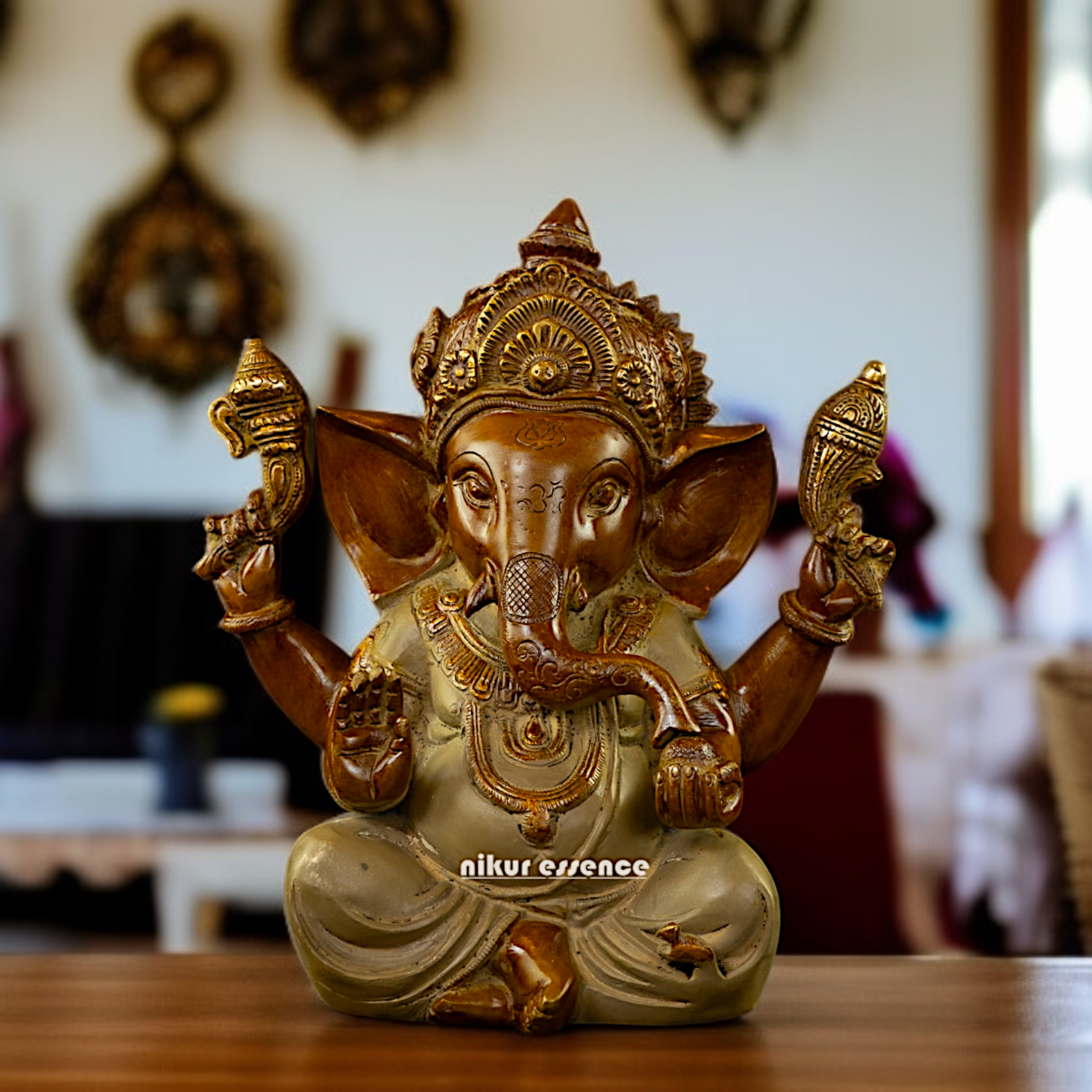 Ganpati seated Blessing with Four Armed Brass idol - 9 Inches Nikuressence