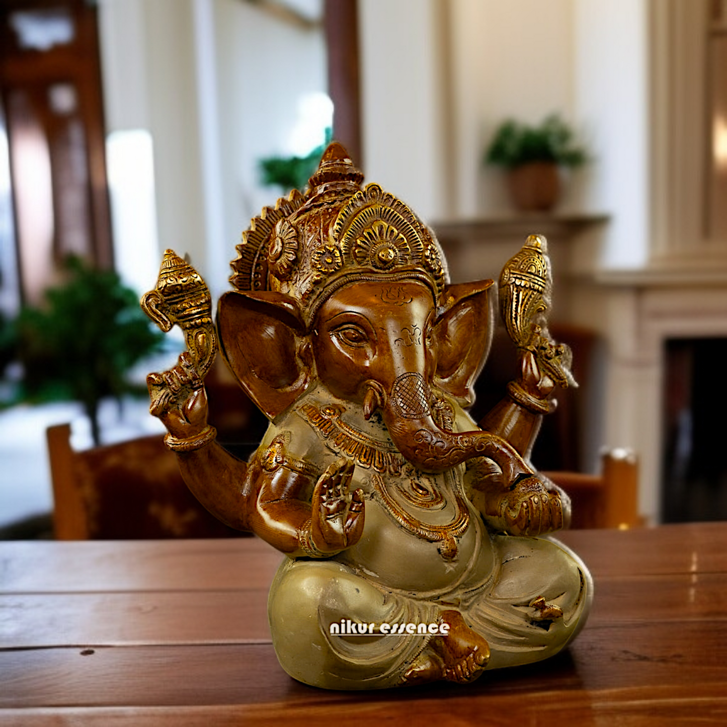 Ganpati seated Blessing with Four Armed Brass idol - 9 Inches Nikuressence