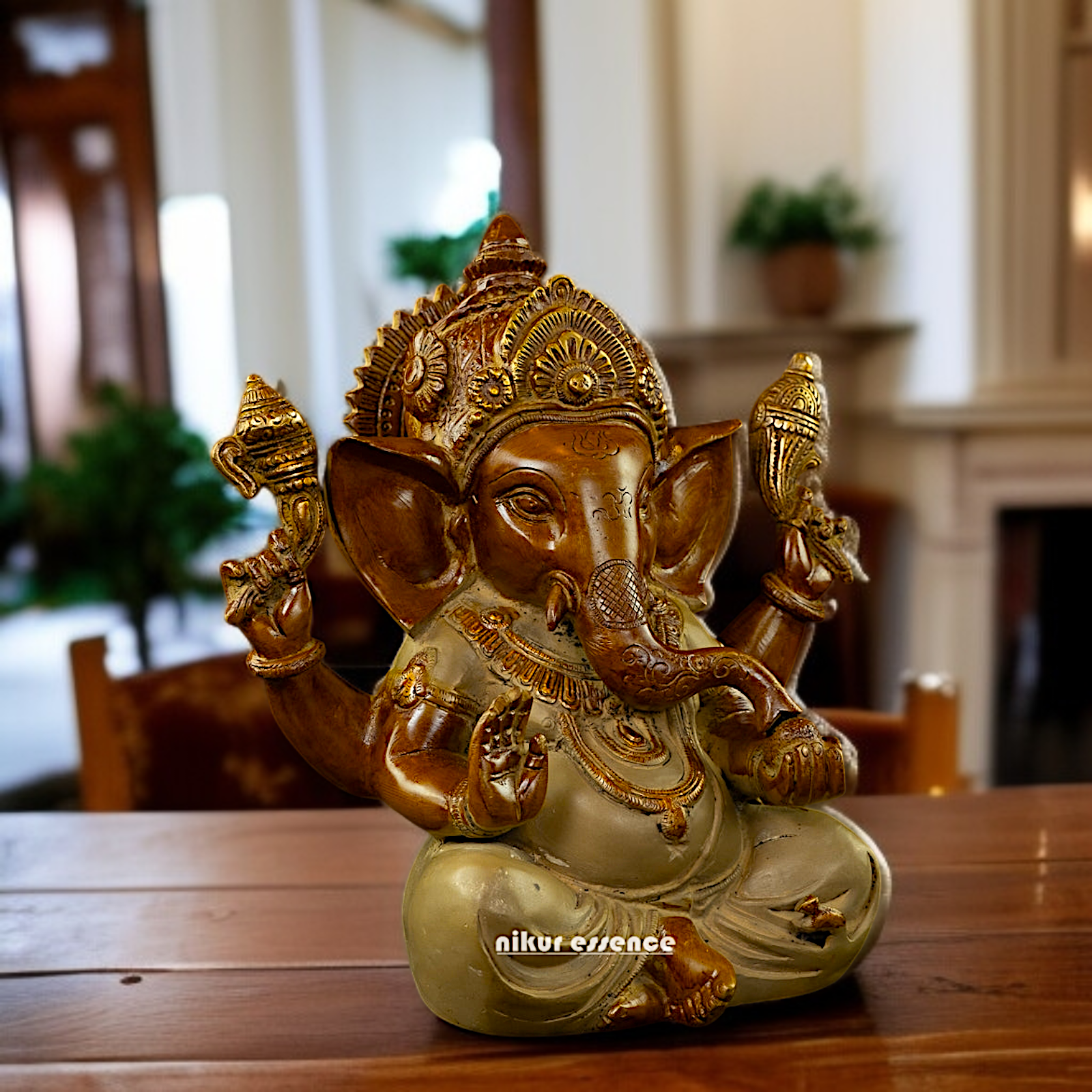 Ganpati seated Blessing with Four Armed Brass idol - 9 Inches Nikuressence
