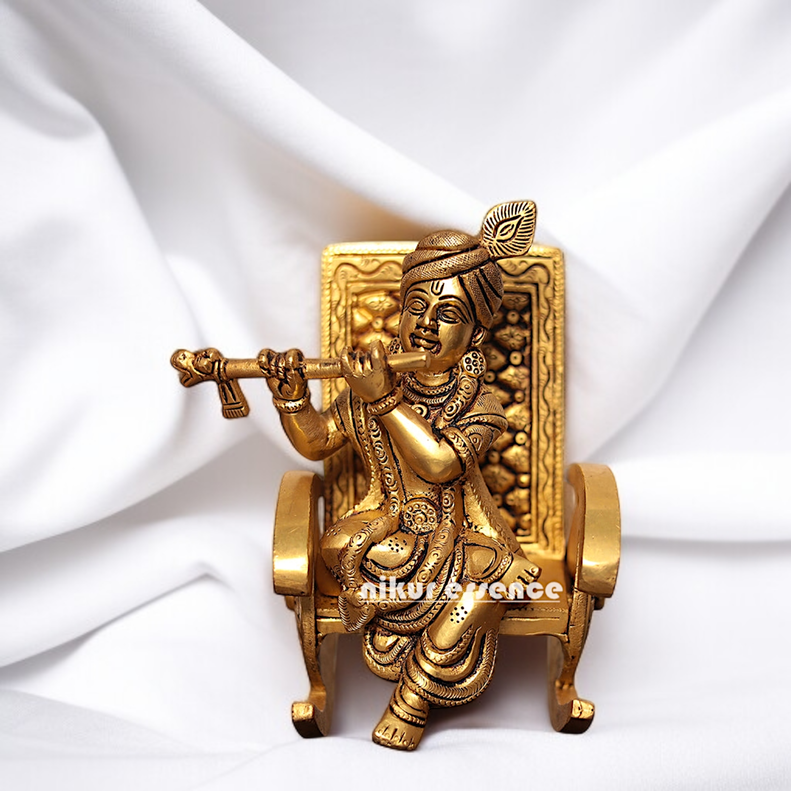 Pure Brass Krishna seated on swinging chair with Playing Flute idol - 6.5 Inches Nikuressence