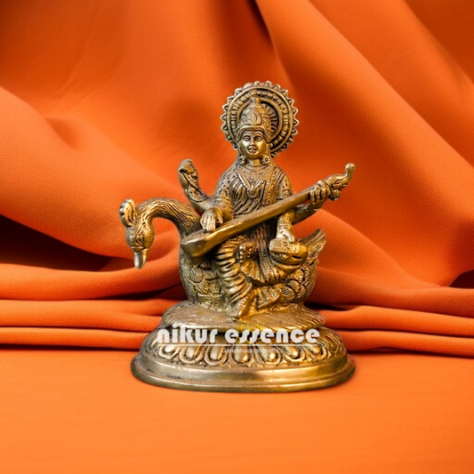 Goddess Saraswati Maa Playing Veena Seated on swan Brass idol - 6.5 Inches Nikuressence