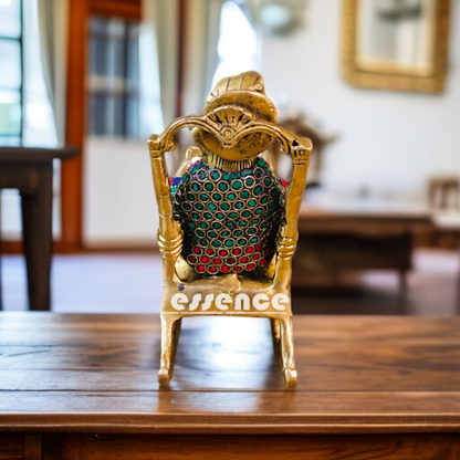 Ganesha Read Book Seated on swing chair Brass with stone work idol - 7 Inches Nikuressence