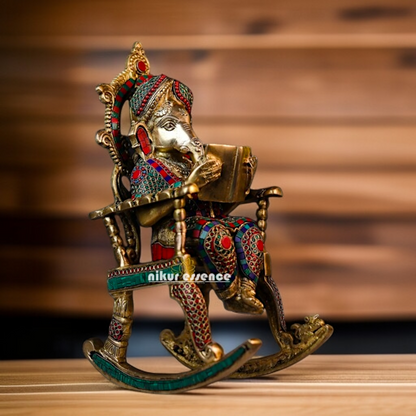 Lord Ganesha seated on swing chair with read book Brass stone work idol - 17 Inches Nikuressence