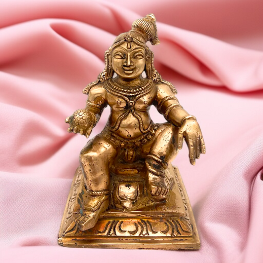 Bronze Panchaloha Bal krishna Laddoo Gopal seated idol - 6.5 Inches Nikuressence