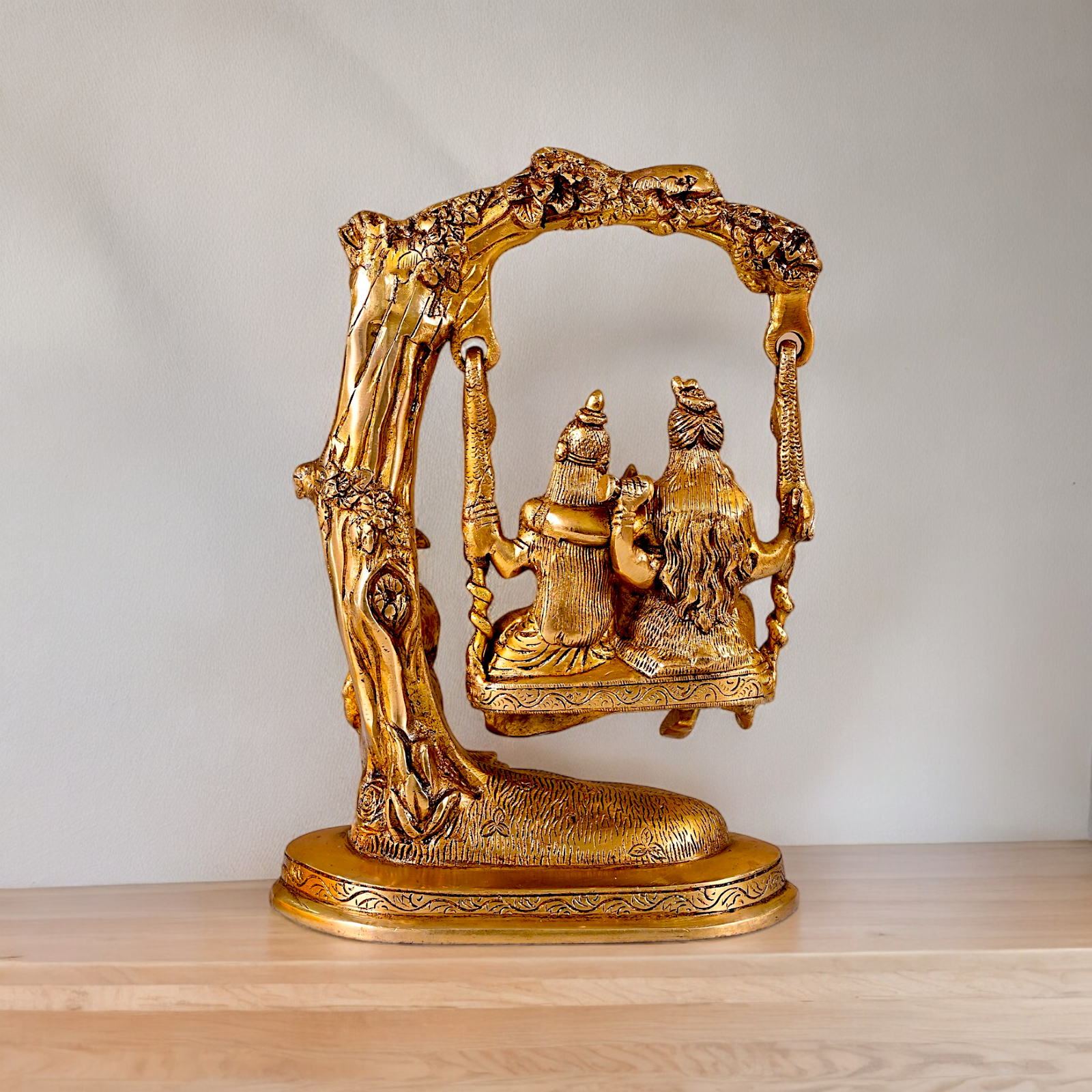 Solid Brass Shiva Parvati and Ganesh Family Sitting on Swing Jhula idol - 9.50 inches Nikuressence