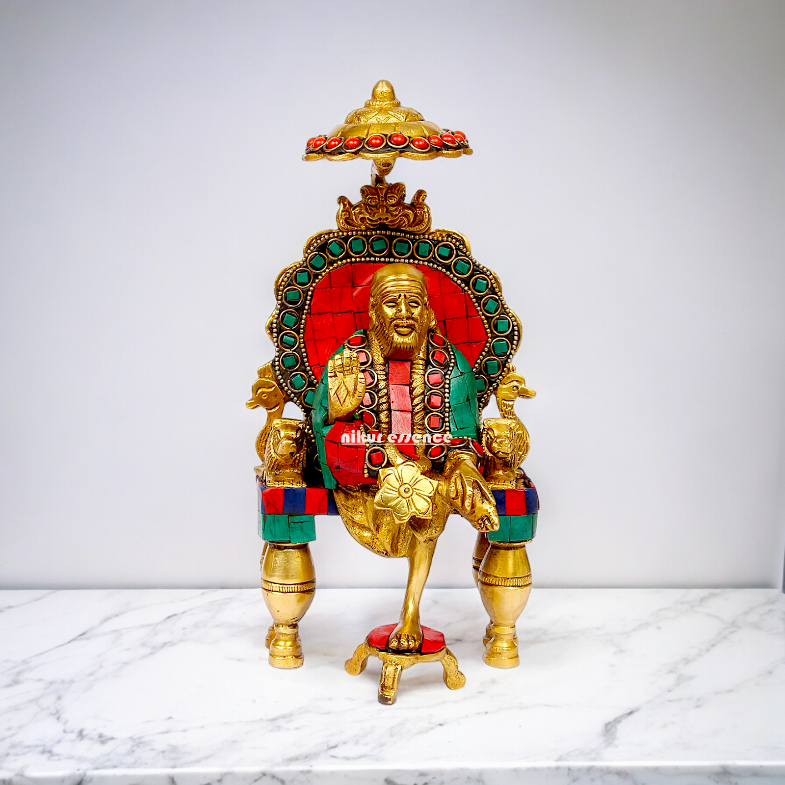 Online Sai Baba Sitting with Blessing Brass Stone Work Idol - 8 inch Nikuressence