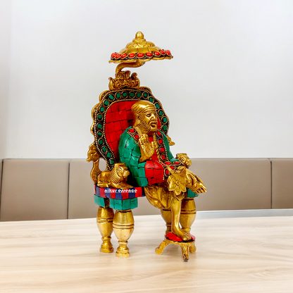 Online Sai Baba Sitting with Blessing Brass Stone Work Idol - 8 inch Nikuressence