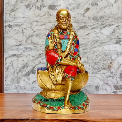 Lord Sai Baba Sitting Idol with Stone Work - 8 Inches Nikuressence