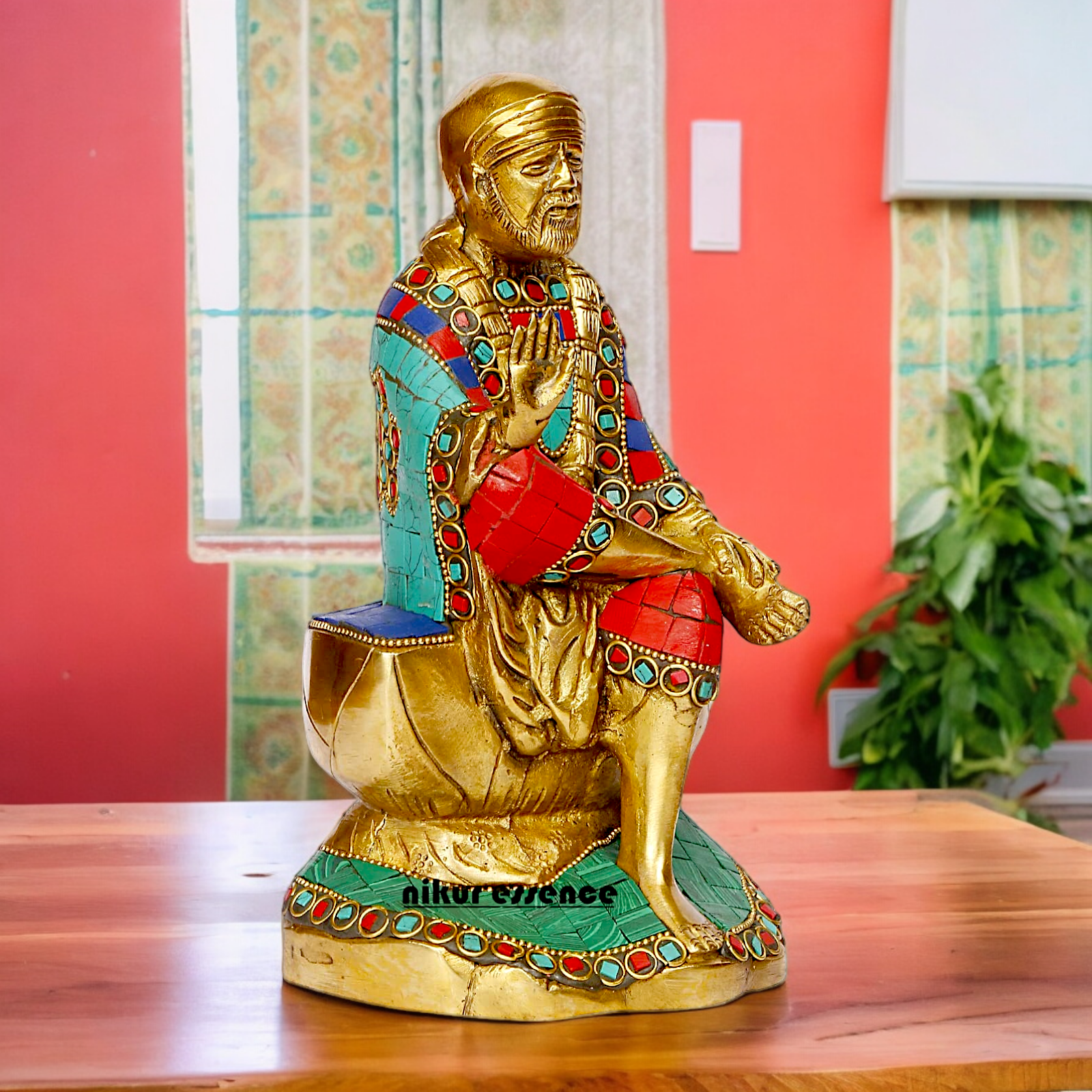 Lord Sai Baba Sitting Idol with Stone Work - 8 Inches Nikuressence