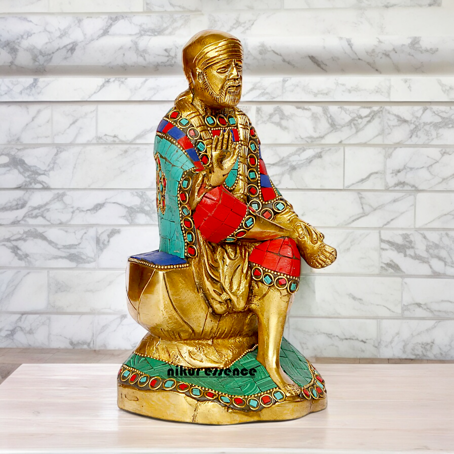 Lord Sai Baba Sitting Idol with Stone Work - 8 Inches Nikuressence