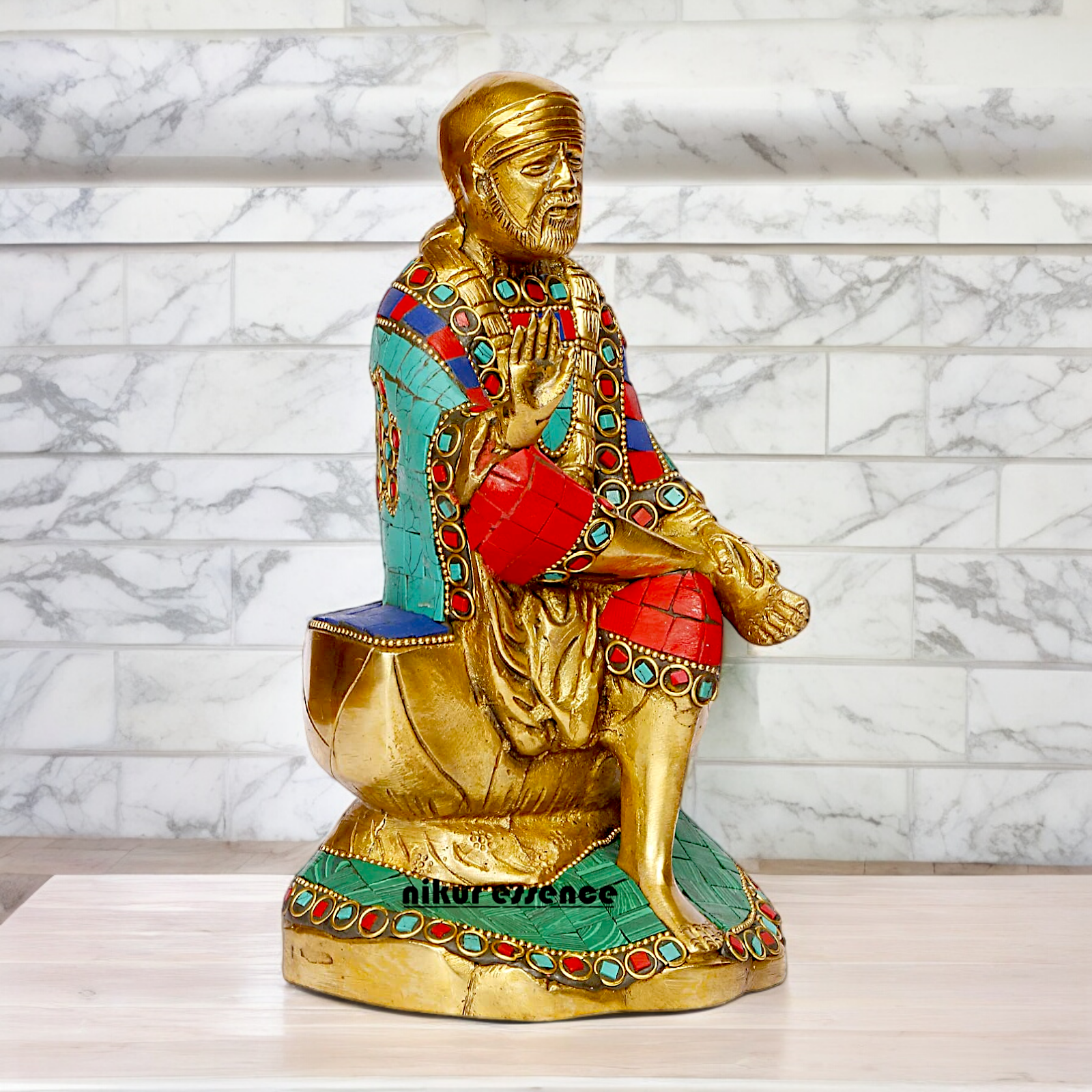 Lord Sai Baba Sitting Idol with Stone Work - 8 Inches Nikuressence