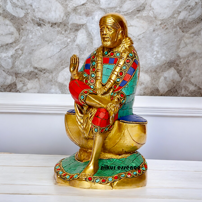Lord Sai Baba Sitting Idol with Stone Work - 8 Inches Nikuressence