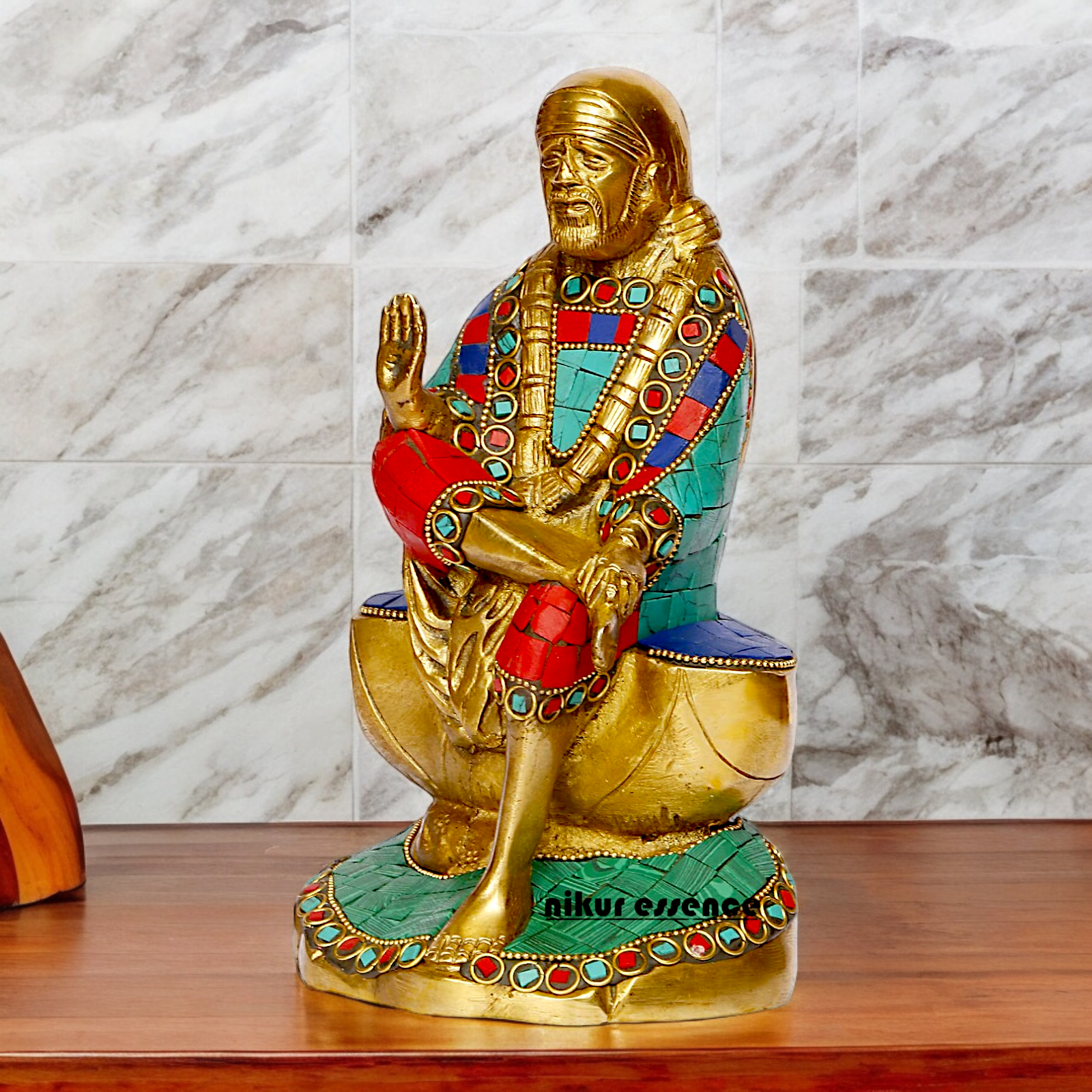 Lord Sai Baba Sitting Idol with Stone Work - 8 Inches Nikuressence
