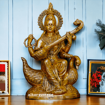 Statue of Hindu in brass Maa Saraswati, Depicted Riding a Swan and Playing the Veena, Symbolizing Wisdom, Arts, and Learning in Hindu Mythology Nikuressence