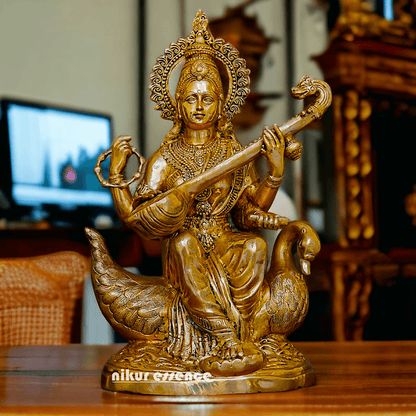 Statue of Hindu in brass Maa Saraswati, Depicted Riding a Swan and Playing the Veena, Symbolizing Wisdom, Arts, and Learning in Hindu Mythology Nikuressence