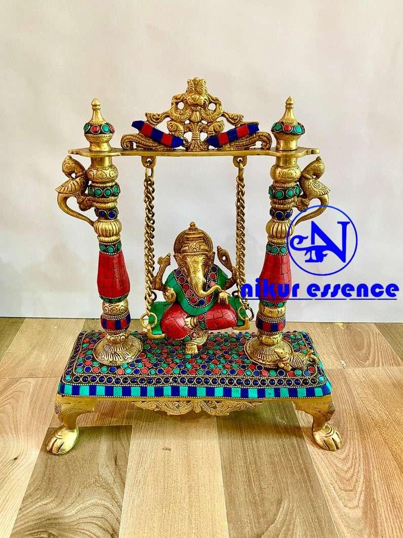 Ganesha Swing Brass Statue with Breathtaking Stone Work, Delicate Patterns, and a Serene Expression Nikuressence